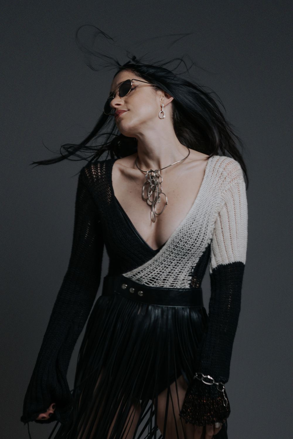 Hair in motion, fringe skirt and pendant necklace